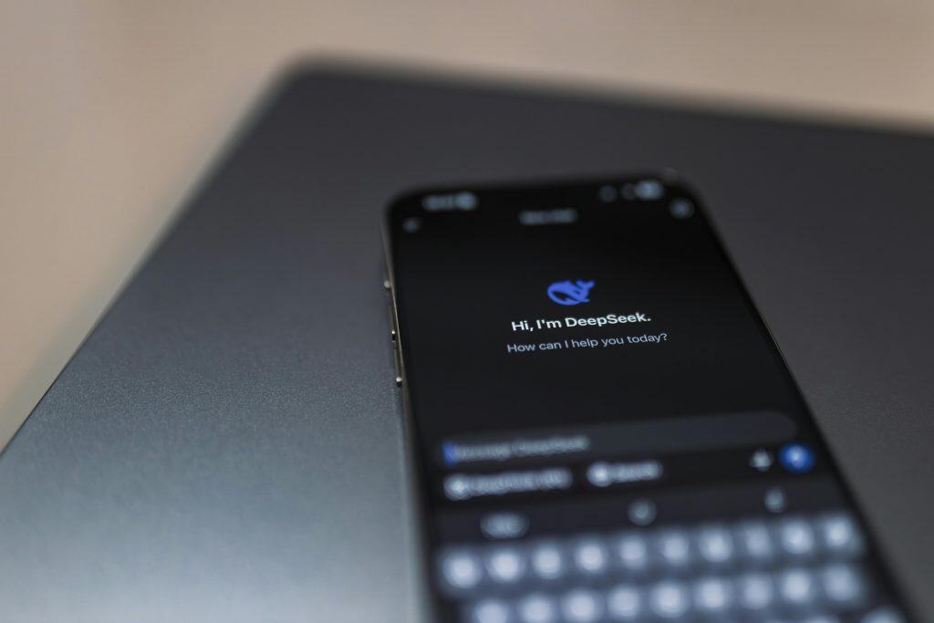 Close-up of a smartphone displaying an AI chat interface with the DeepSeek app.